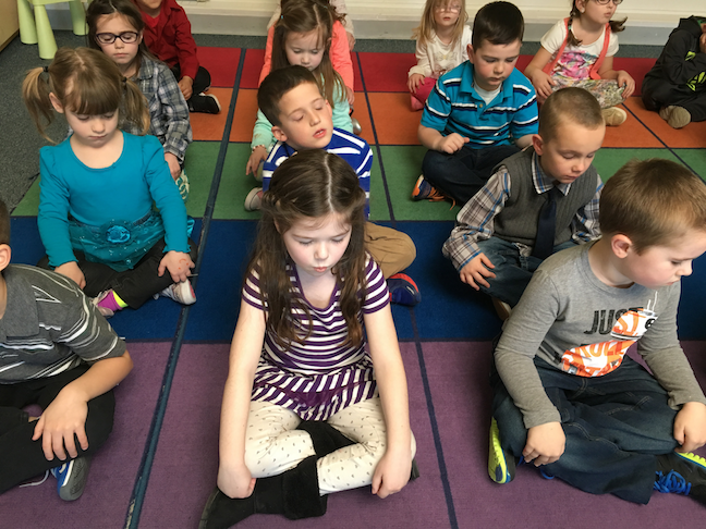 Students at West Bridgewater Public Schools near Boston participate in a classroom relaxation exercise. The district has adopted a wide-ranging curriculum to lower student stress.