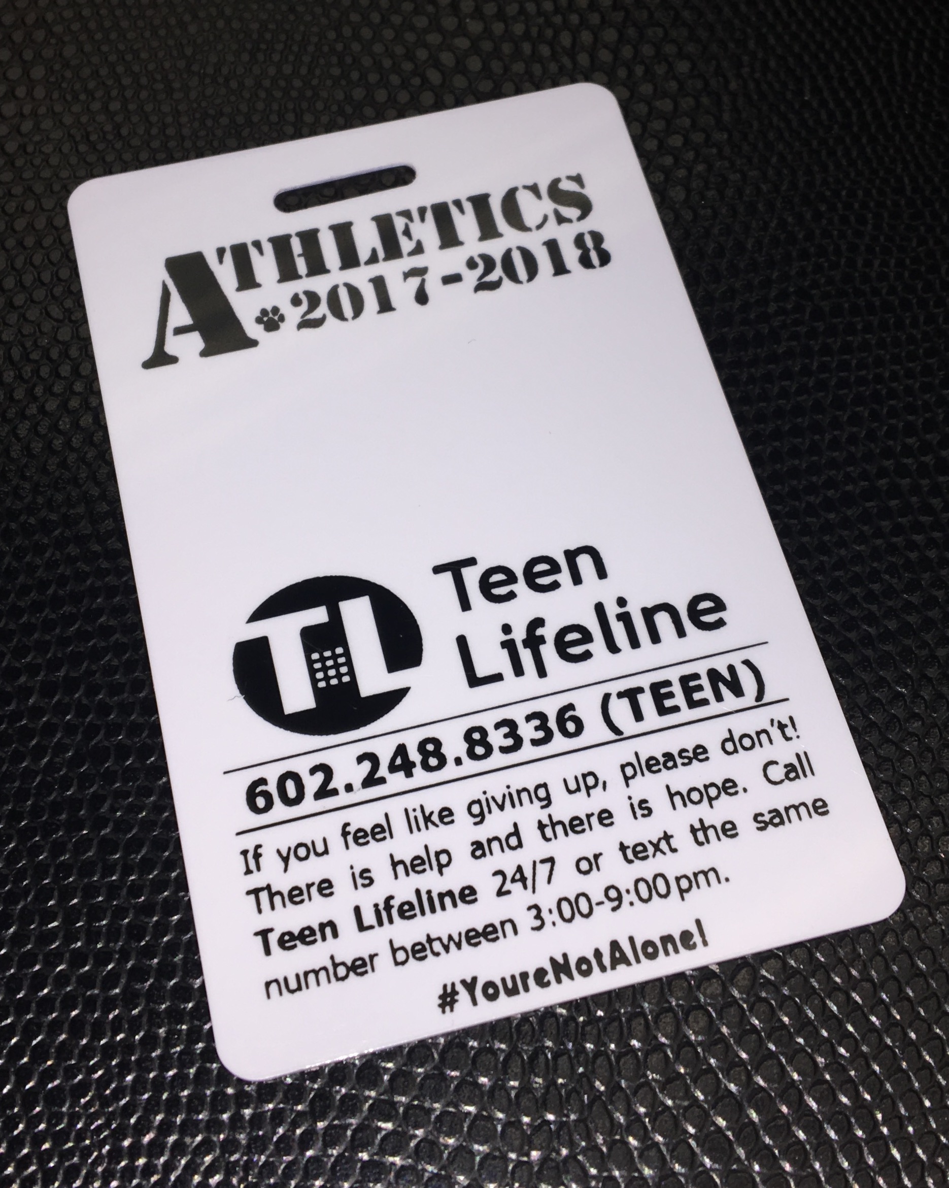 Arizona's Tempe Union High School District prints a suicide hotline number on ID badges.