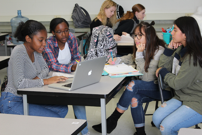 Students collaborate during a service project-planning session at Sussex Technical School District, which has been training teachers to recognize their own implicit bias to better support cultural diversity in the classroom.