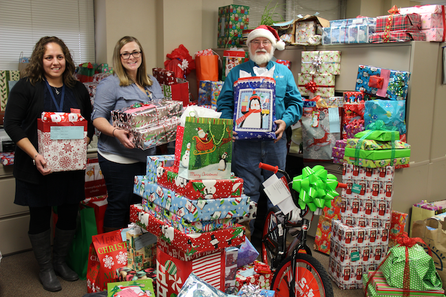 In some districts, such as this school system near Chicago, employees purchase Christmas presents for homeless students.