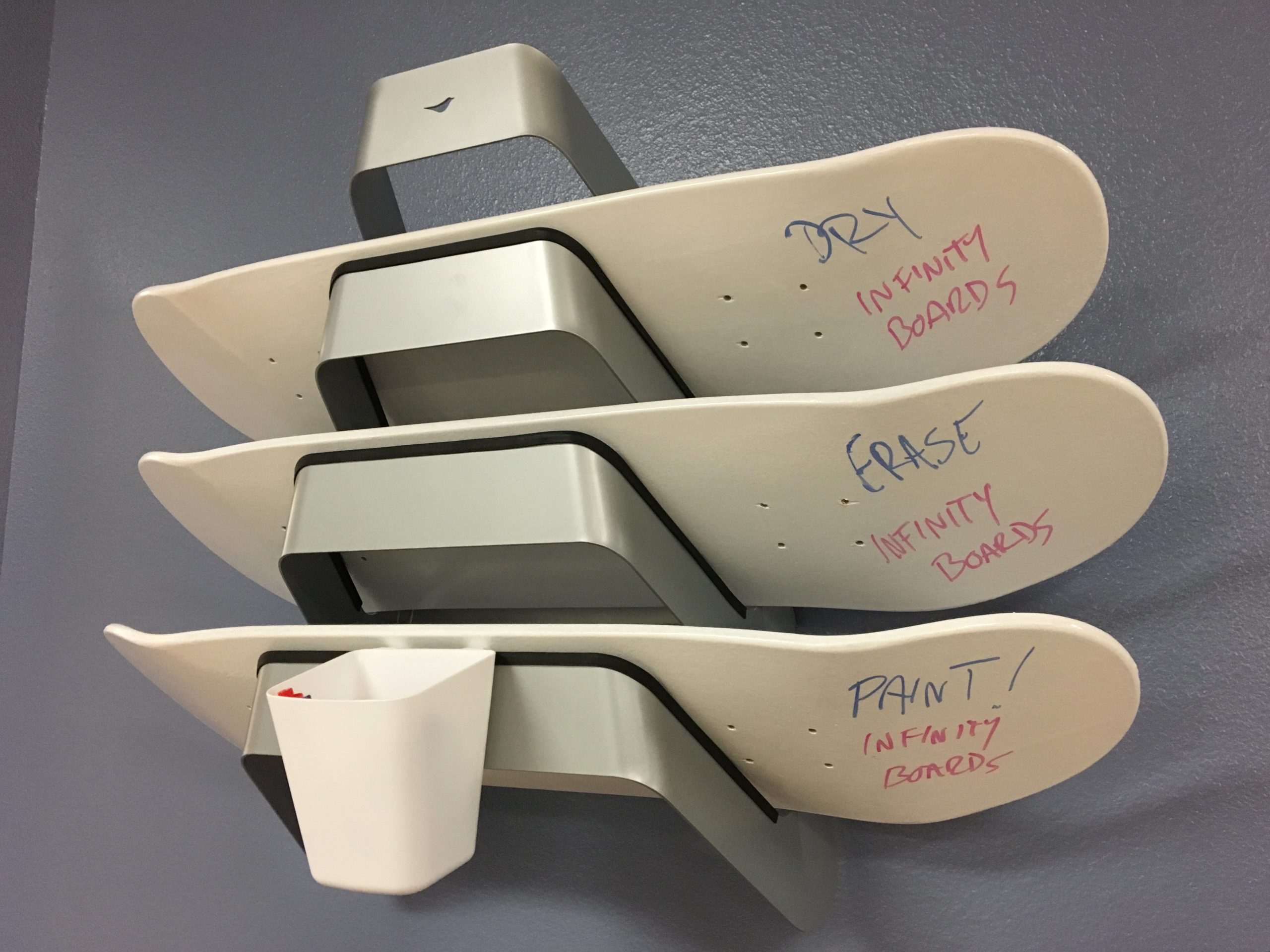 In Flagler Schools, old skateboards, surfboards and cubes are wrapped in glossy spray paint and students can grab them as needed for whiteboard activities. 