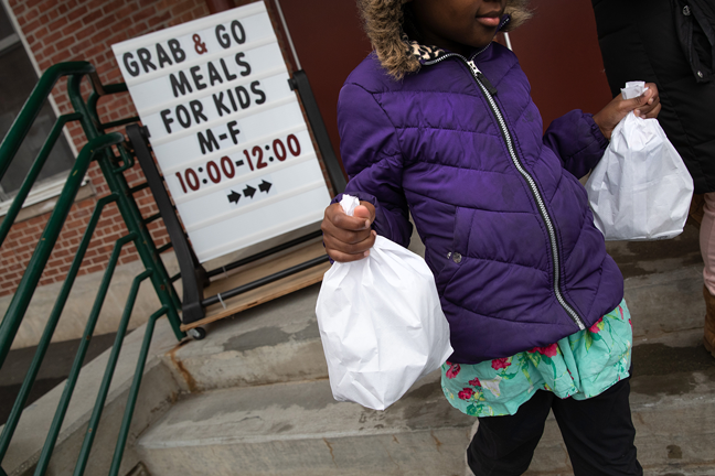 Stamford Public Schools in Connecticut also has a grab-and-go meals program, with each child being offered two bagged meals per day. Photo by John Moore/Getty Images