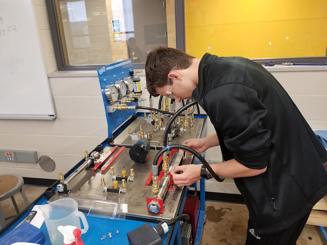A high school student in Wichita Public School works on a project in the district's aviation manufacturing CTE pathway. Administrators in the Kansas school system worked with the city’s airplane manufacturers to create the program.