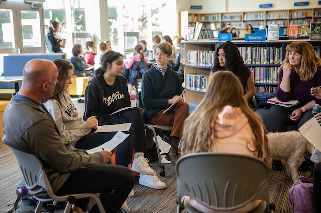 Students from Newburyport High School in Massachusetts lead dialogues with students and teachers from nearby Nock Middle School in this pre-COVID photo.