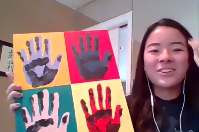 A High School District 214 student shows off a humanities project during an online learning session.