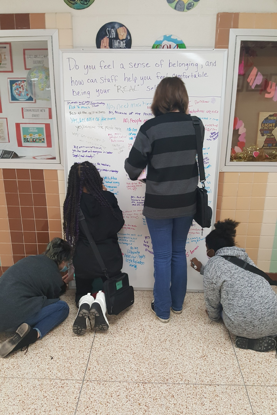 Students write about their sense of belonging in the principal's "office on wheels" at Western Branch Middle School in Chesapeake, Virginia.