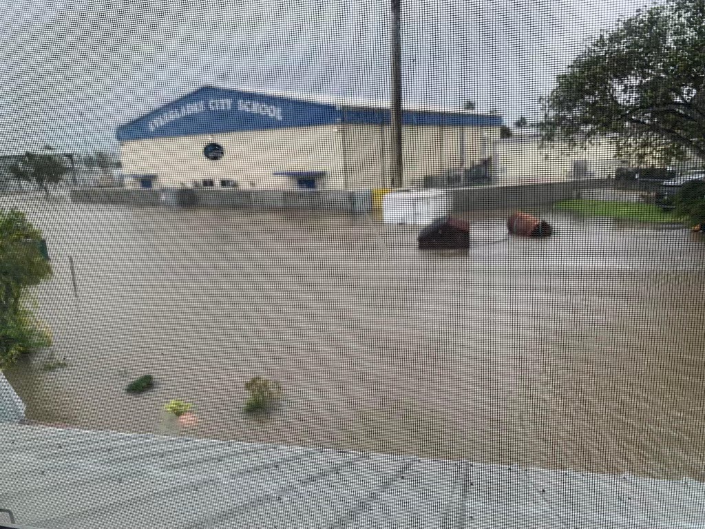 A floodwall protected Everglades City School from storm surge flooding.